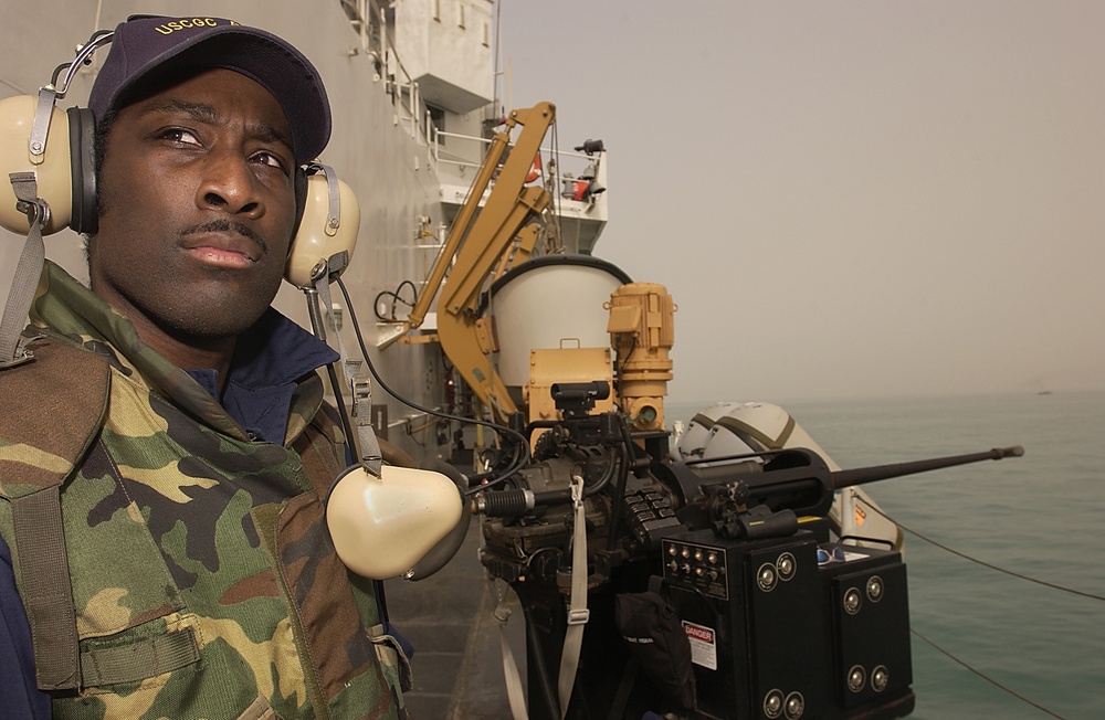 Manning a 25 mm machine gun