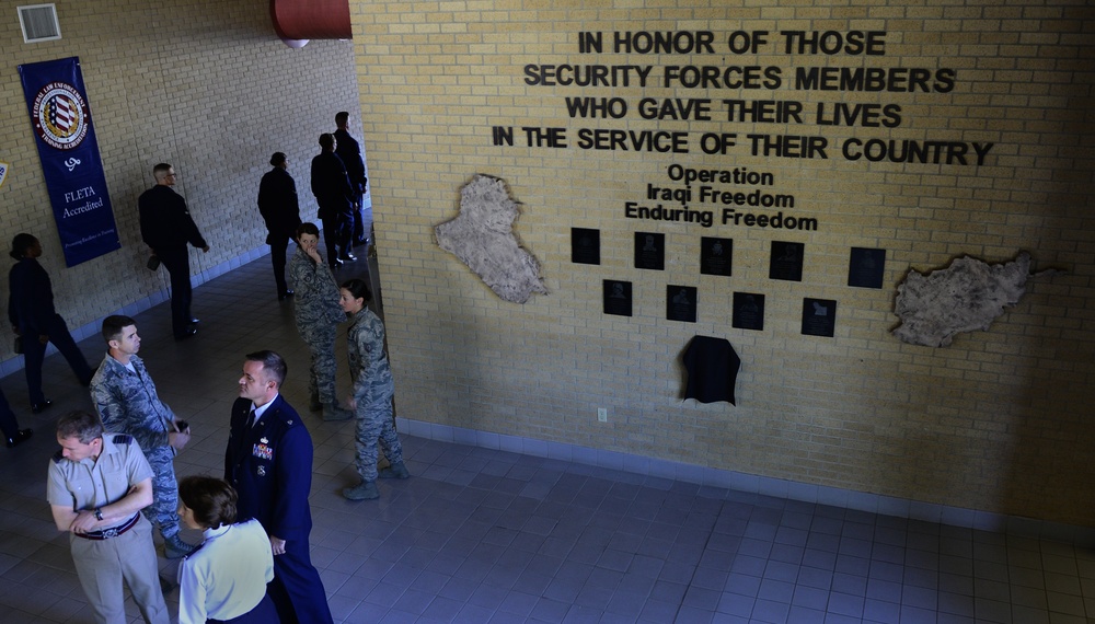 Plaque dedication onto the Security Forces Fallen Defender Wall