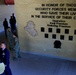 Plaque dedication onto the Security Forces Fallen Defender Wall