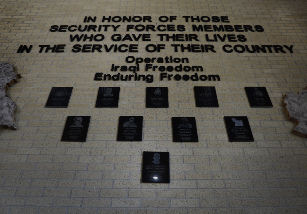 Plaque dedication onto the Security Forces Fallen Defender Wall