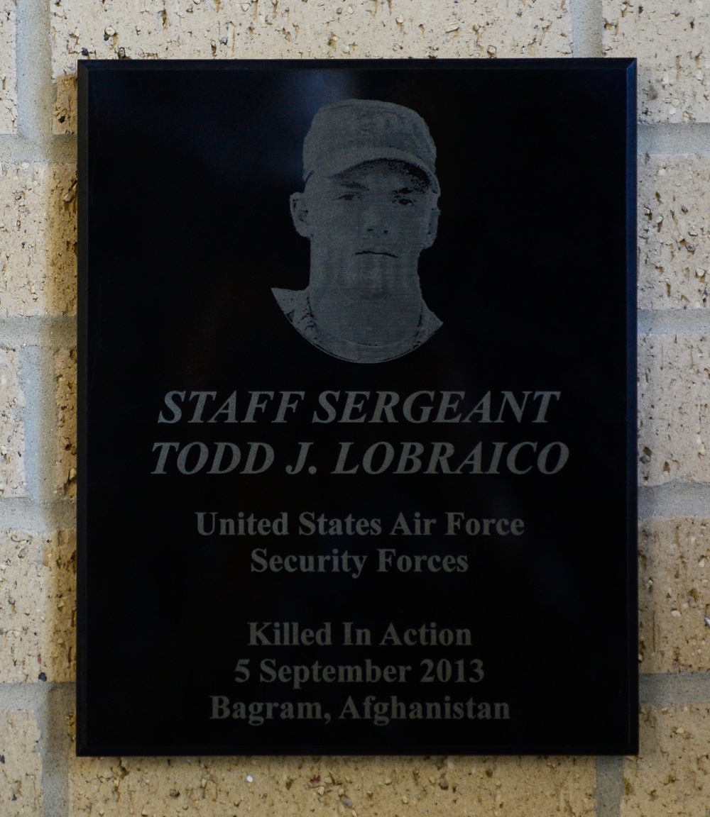 Plaque dedication onto the Security Forces Fallen Defender Wall