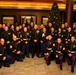 Service members from different bases meet during Toys for Tots dinner