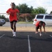 Local Marine recruiter gives back by coaching youth track club