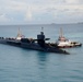 USS Georgia prepares to moor alongside USS Emory S. Land