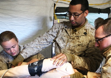 MLG Shock Trauma Platoon patches Marines, sailors up for fight during Steel Knight 14