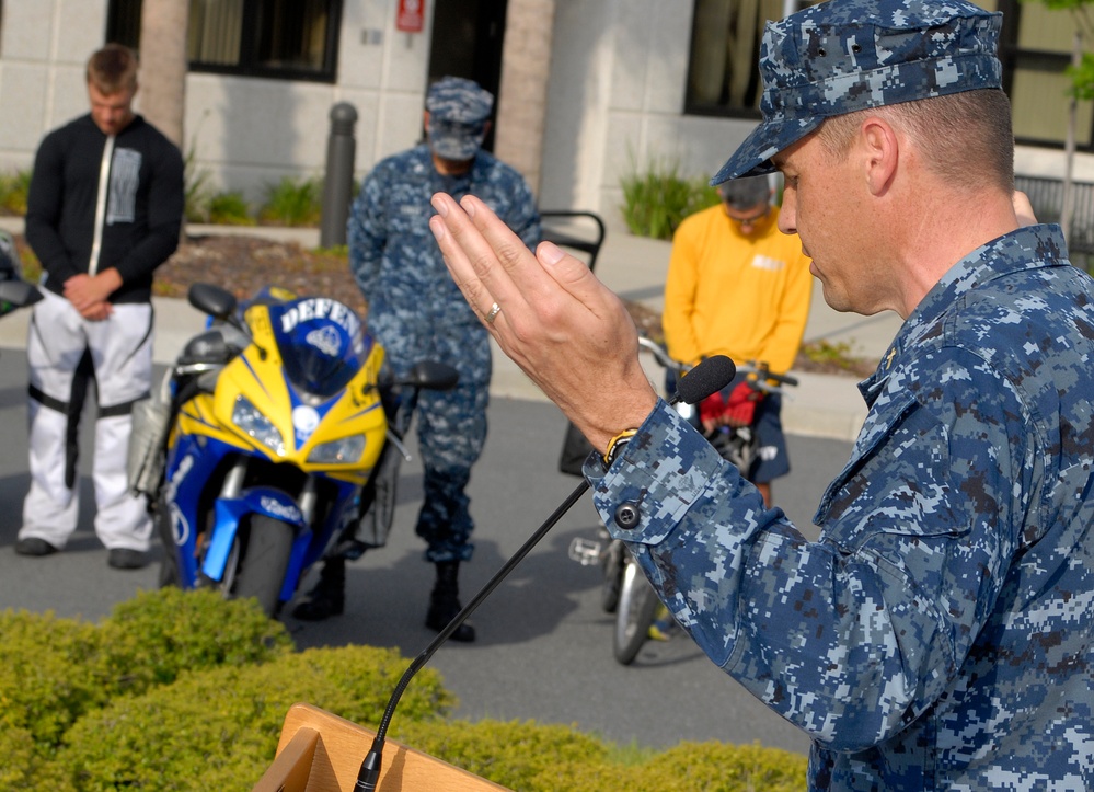 Chaplain conducts prayer at blessing of the bikes ceremony