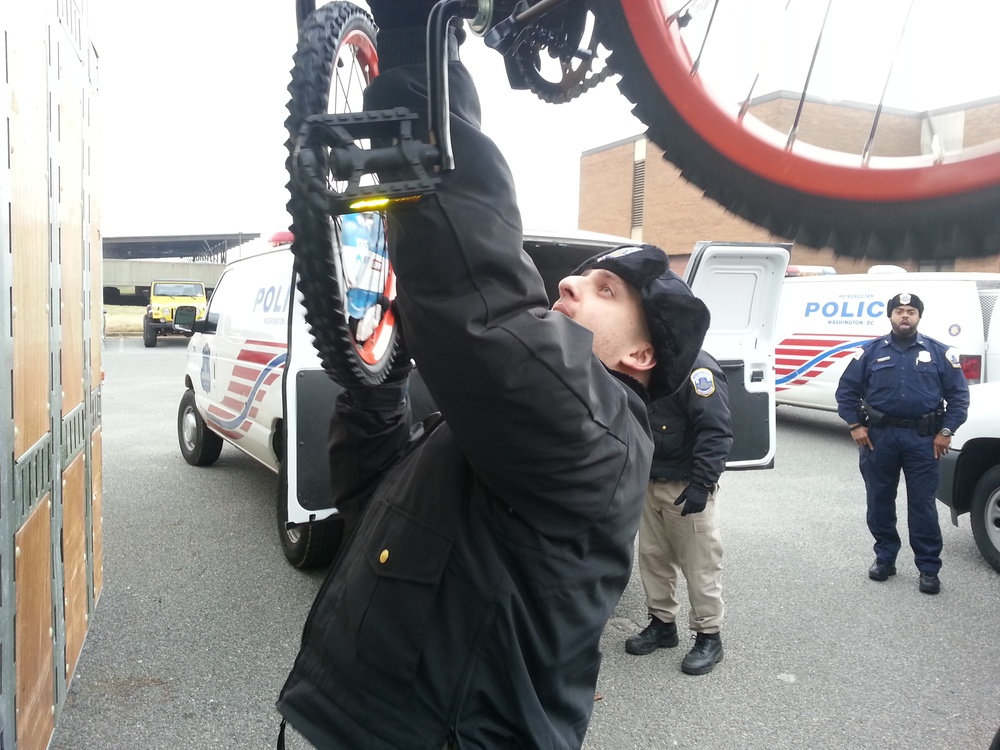 Police cadets help distribute Toys for Tots bicycles