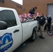 Police officers load bicycles donated to the Toys for Tots program