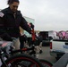 Cadet from the Metropolitan Police Department Academy loads a bicycle, one of many donated to the Toys for Tots program