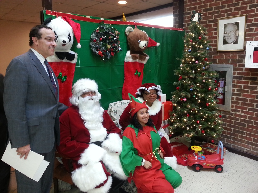 DC Mayor Vincent Gray poses for photographers after wishing a Merry Christmas to youth