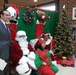 DC Mayor Vincent Gray poses for photographers after wishing a Merry Christmas to youth
