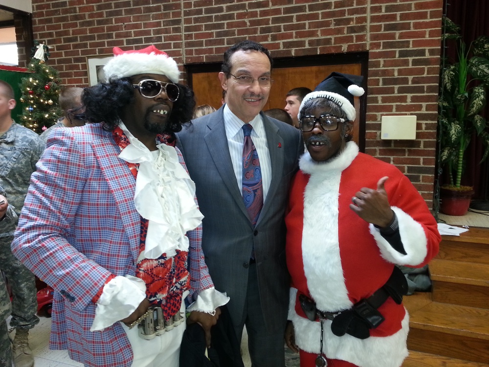 DC Mayor Vincent Gray with two of Santa’s assistants