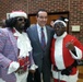 DC Mayor Vincent Gray with two of Santa’s assistants