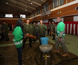 Bilateral rice pounding brings in new year