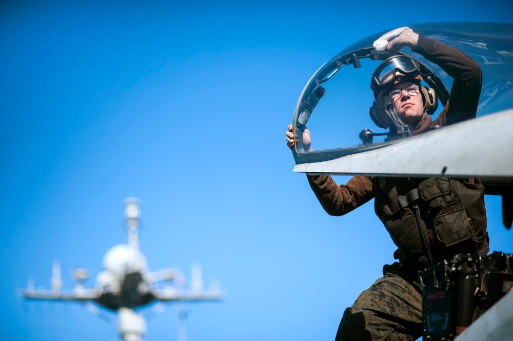 Cleaning the canopy of an F/A-18C Hornet