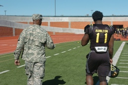 Father and son walk on the field