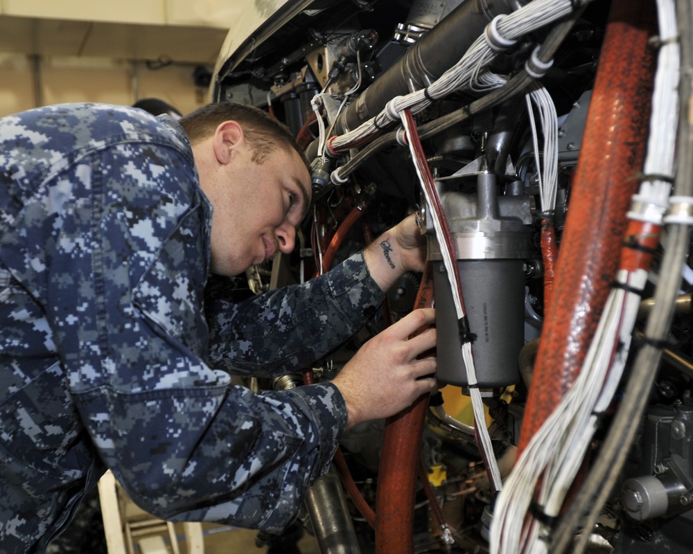 AIMD Misawa sailor performs maintenance on P-3 Orion
