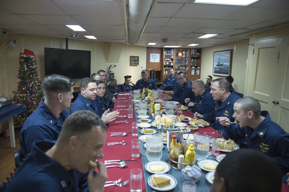 Navy officer eat Christmas dinner aboard USS Stout