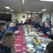 Navy officer eat Christmas dinner aboard USS Stout