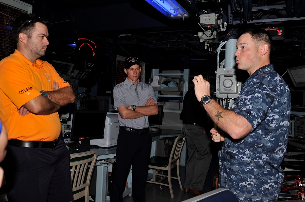 Professional golfer visits former ship