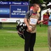 Service members caddy for professional golfers during Pro-Am event