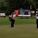 Service members caddy for professional golfers during Pro-Am event