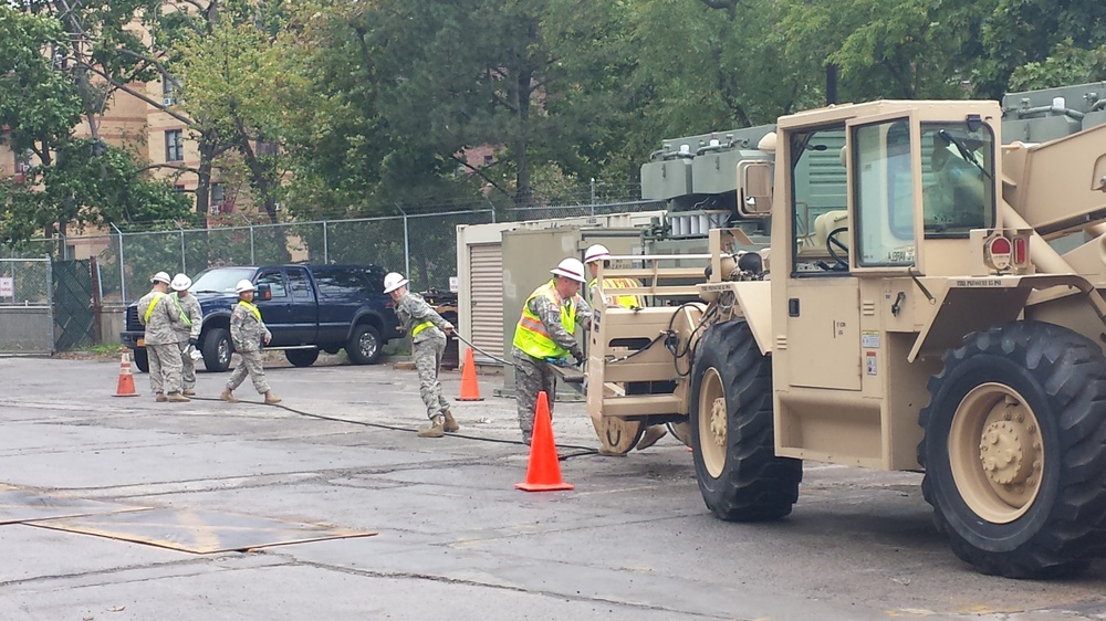 249th Engineer Battalion prepares cables for connection to generator