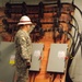 A member of the 249th Engineer Battalion inspects connections