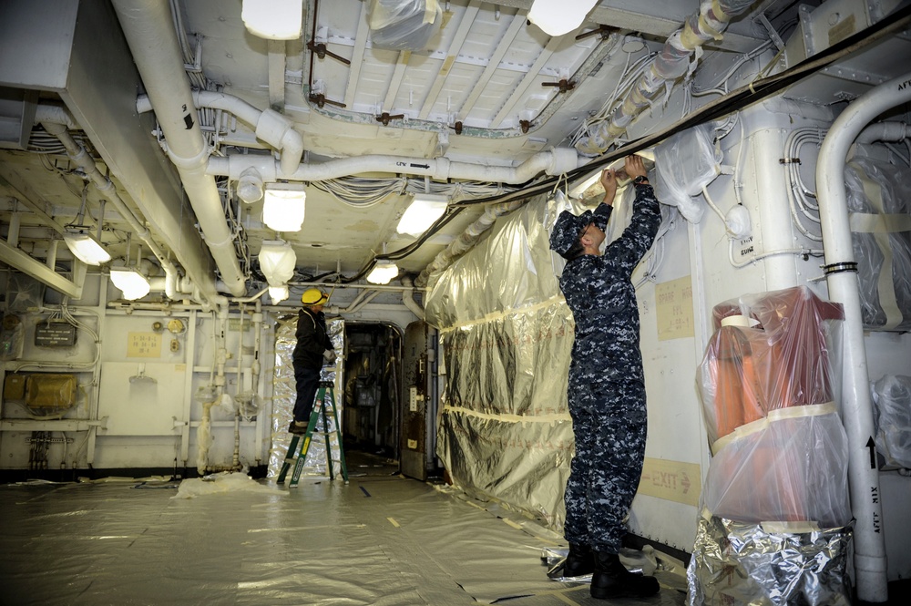 USS Nimitz sailors prep for paint