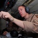 Aircrewman conducts pre-flight procedures