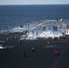 Sailors scrub USS Harry S. Truman flight deck