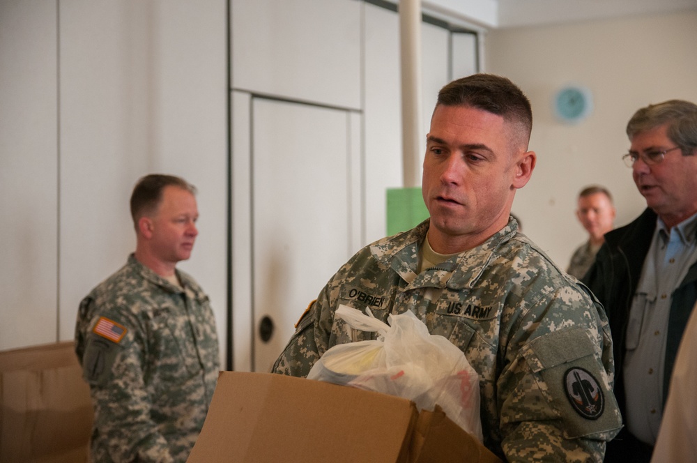 Soldiers volunteer to help those in need with food
