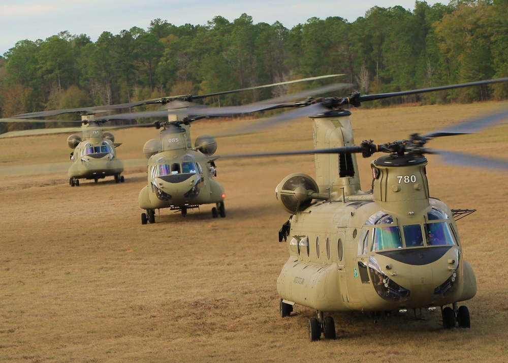 A CH-47F Chinook, foreground, and a UH-60 Black Hawk 