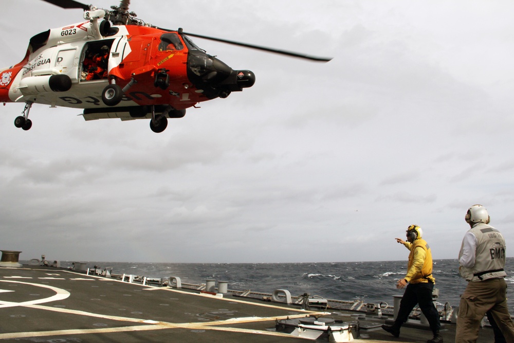 Coast Guard refuels aboard Navy ship during rescue mission