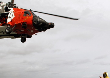 Coast Guard refuels aboard Navy ship during rescue mission