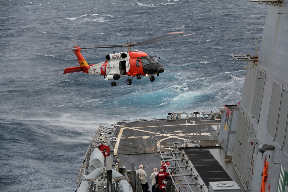 Coast Guard refuels aboard Navy ship during rescue mission