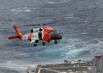 Coast Guard refuels aboard Navy ship during rescue mission