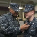 Forward-deployed mass communication specialist wears father's ESWS pin
