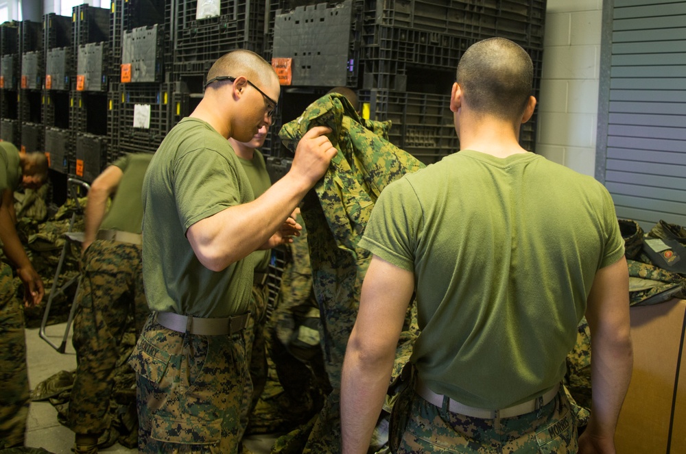 Marine recruits work together to help out around Parris Island