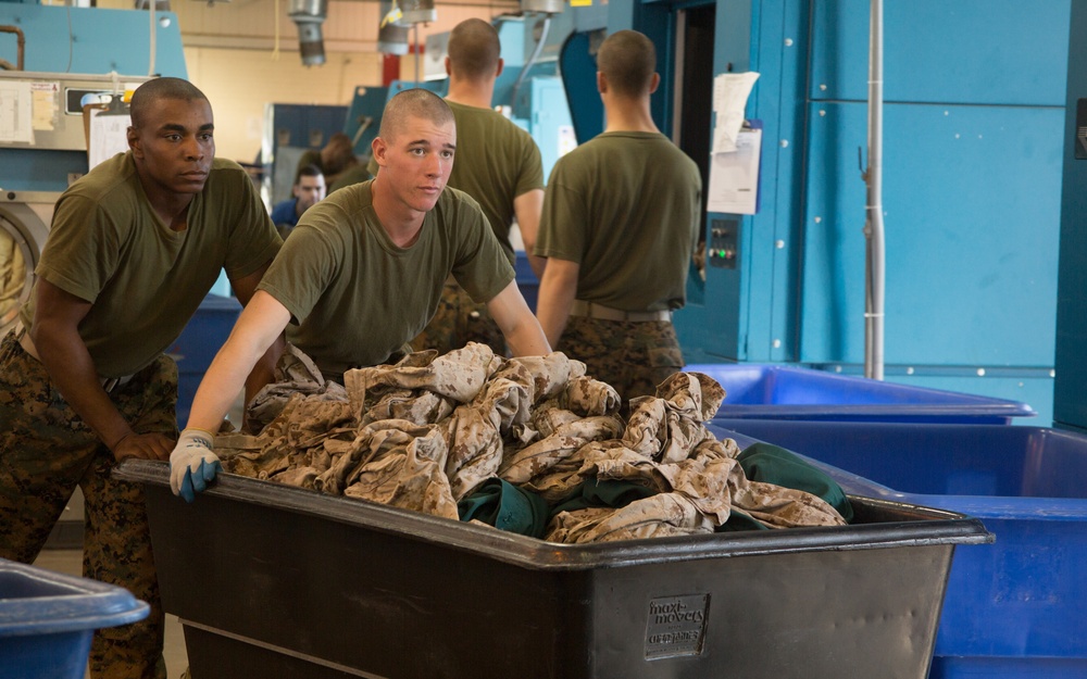 Marine recruits work together to help out around Parris Island