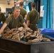 Marine recruits work together to help out around Parris Island