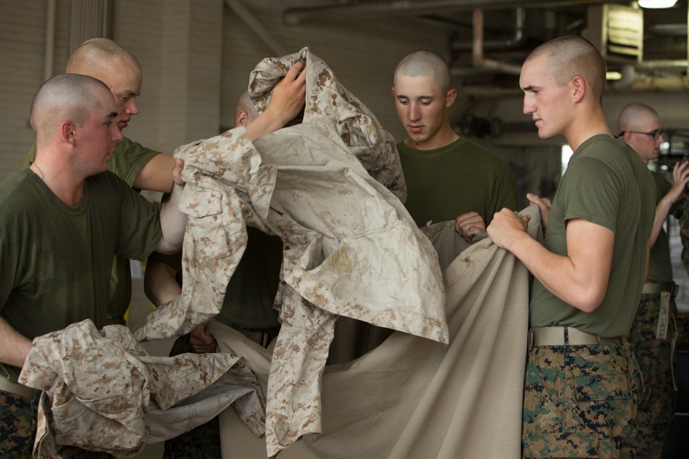 Marine recruits work together to help out around Parris Island