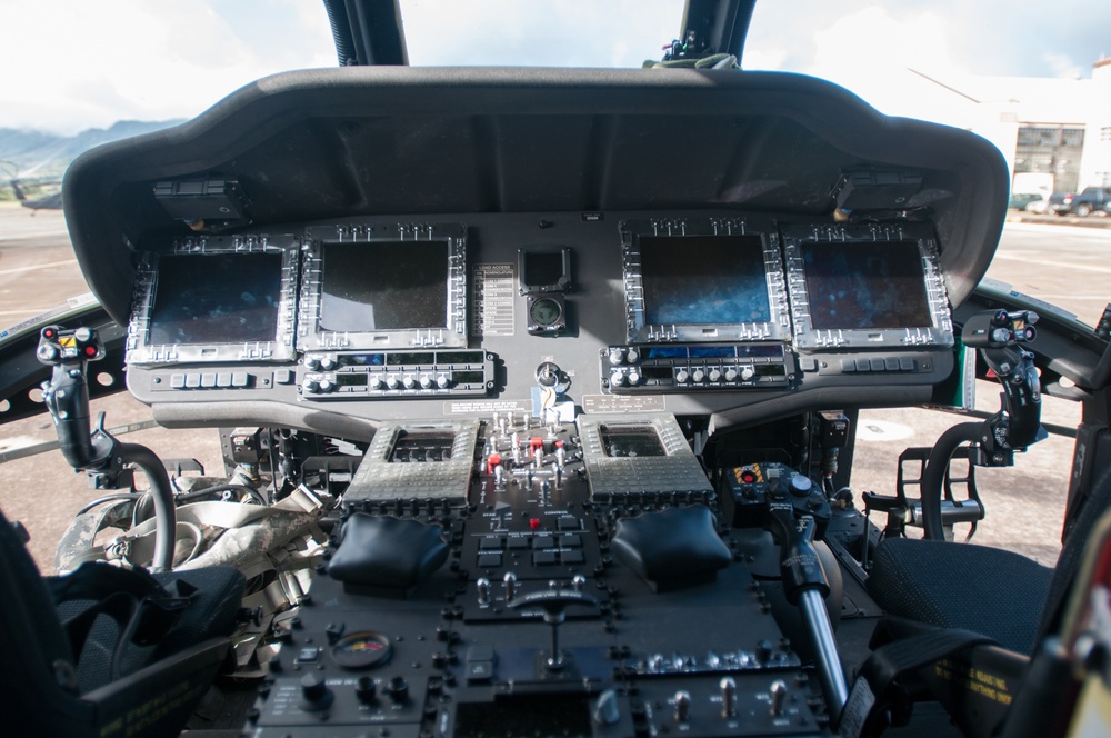 The view inside of an M model Black Hawk showing new digital systems and upgraded aviation flight systems.