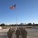 Officer candidates lower national colors at Fort Benning