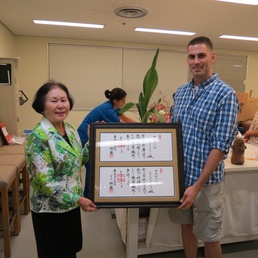 Capt. “Renoll-saince” Man embraces Ikebana