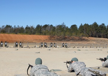 Soldiers fire SCAR heavy weapon