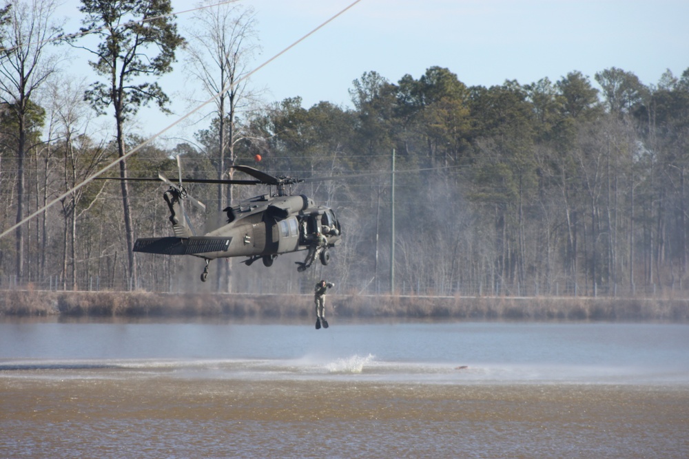 Instructors demonstrate water insertion from UH-60 Black Hawk during Ranger School graduation