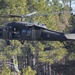 Instructors demonstrate fast rope insertion from UH-60 Black Hawk during Ranger School graduation