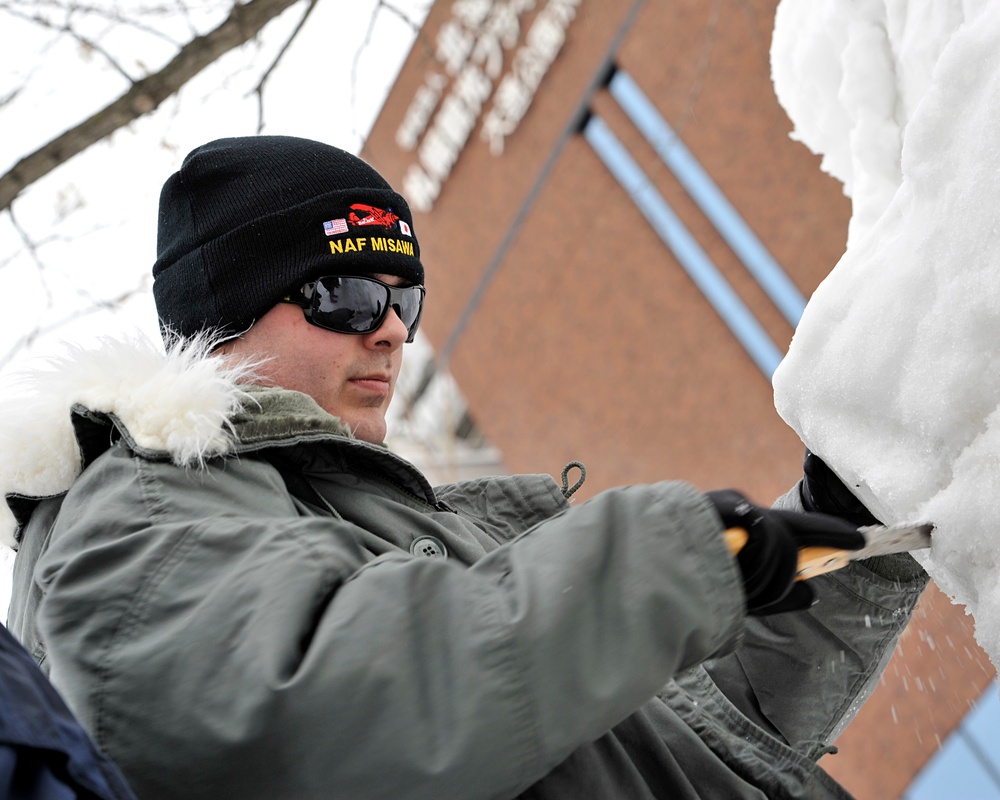 2014 Navy Misawa Snow Team commence work on snow sculpture