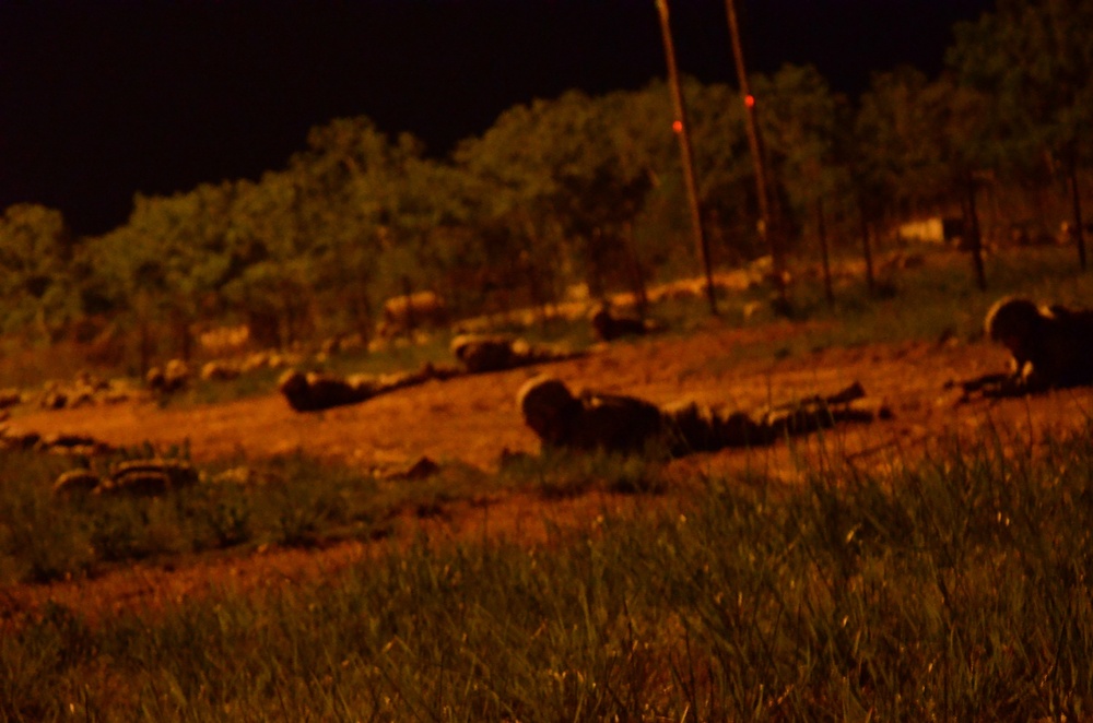 Basic Combat Training soldiers from Echo Company, 1/48 Infantry Regiment navigate through the Night Infiltration Course